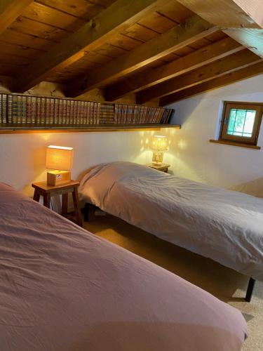 a bedroom with two beds and a window at Chalet Erminea in Chamonix