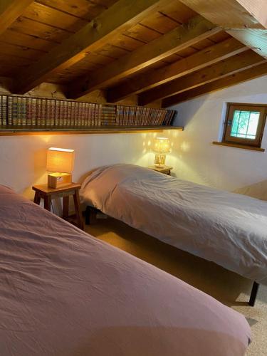 a bedroom with two beds and a window at Chalet Erminea in Chamonix-Mont-Blanc