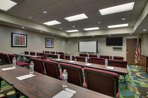 a conference room with tables and chairs and a screen at Hampton Inn DuBois in DuBois
