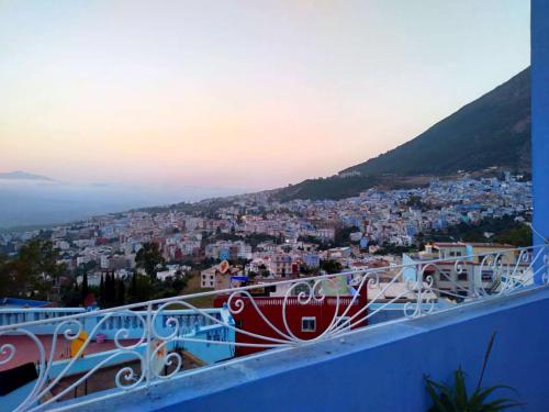 a view of a city from the top of a building at Dar Achraf in Chefchaouene