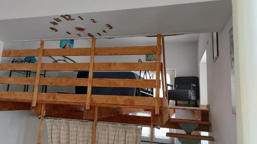 a bunk bed in a room with a ladder at Home & Bed Spartano in Sapri