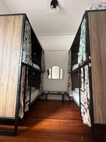 Postel nebo postele na pokoji v ubytování Meridiano Hostel Boutique