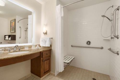 a bathroom with a sink and a shower at Homewood Suites by Hilton Fargo in Fargo