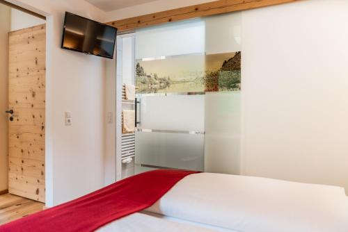 Postel nebo postele na pokoji v ubytování Aparthotel Ramsau