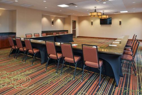 a large conference room with a long table and chairs at Hampton Inn Frederick in Frederick