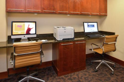 an office with two computers and a printer on a desk at Hampton Inn Frederick in Frederick