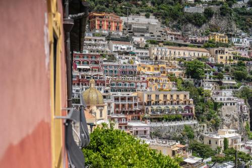 a view of a city from a building at Albergo Miramare Positano in Positano