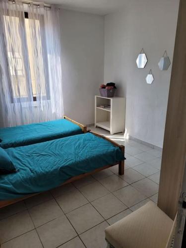 Säng eller sängar i ett rum på Appartement Le Cricoune
