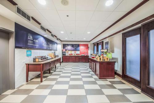a fast food restaurant with a checkered floor at Hampton Inn Greenfield in Greenfield