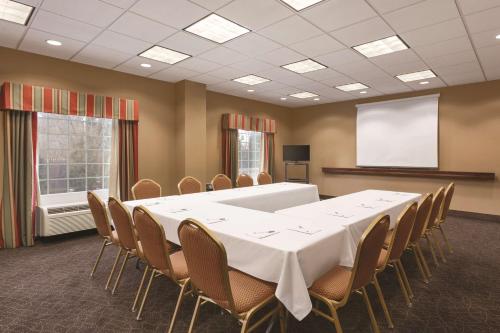 a conference room with a white table and chairs at Hampton Inn & Suites Greenfield in Greenfield