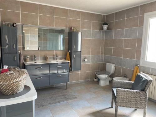 a bathroom with a sink and a toilet in it at SICILIA VILLA in La Ciotat