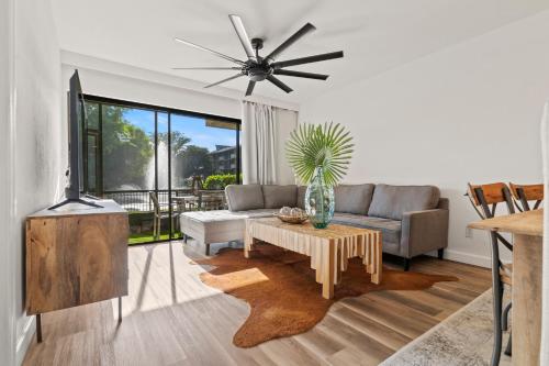 a living room with a couch and a table at Park Shore Resort in Naples