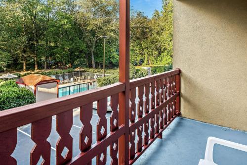 a balcony with a view of a pool and trees at Hampton Inn Helen in Helen