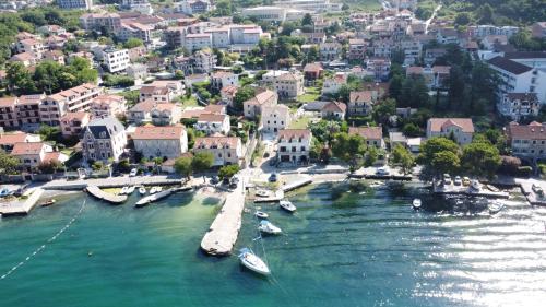 an aerial view of a town with boats in the water at Rooms & Apartments Vukasović in Kotor