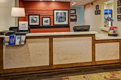 a lobby of a hospital with a reception counter at Hampton Inn Houston Baytown in Baytown