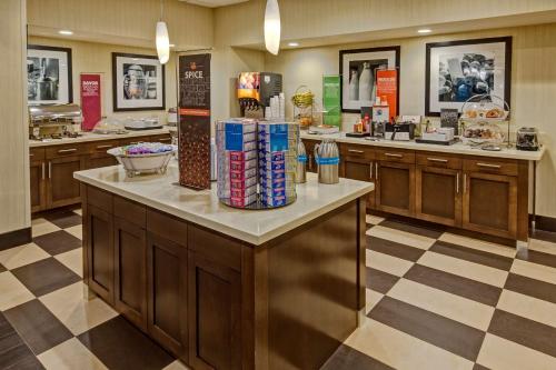 a fast food restaurant with a counter with food at Hampton Inn Houston Baytown in Baytown