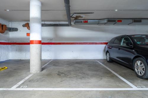 a car parked in a parking lot at Hauzify I Casa Palou in Palamós