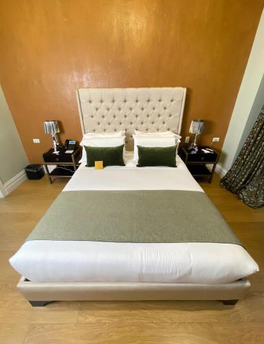 Postel nebo postele na pokoji v ubytování Itza Hotel Boutique Internacional
