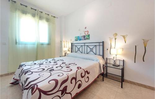 a bedroom with a large bed and a window at San Jorge Castellon in San Jorge