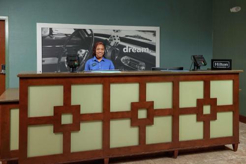 a woman standing at a podium in front of a screen at Hampton Inn Bermuda Run / Advance in Bermuda Run