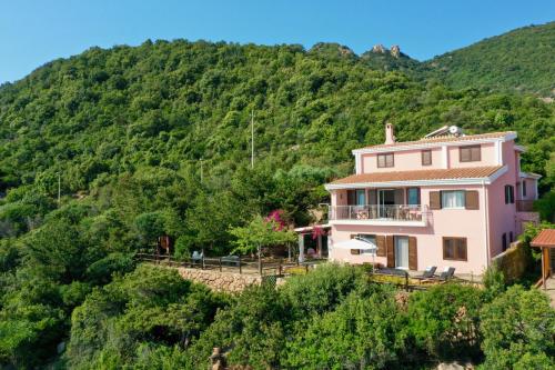 a house on the side of a mountain at VILLA GIU MAR 2 Jennas in Cardedu