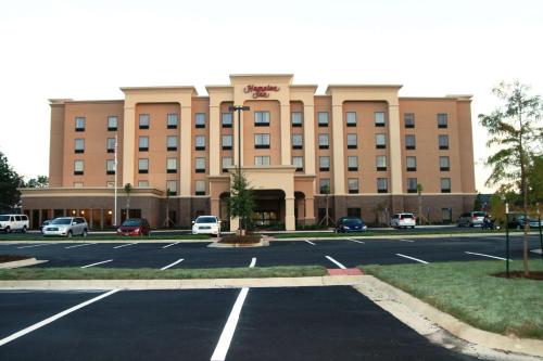 a large building with a parking lot in front of it at Hampton Inn Jackson/Flowood - Airport Area MS in Flowood