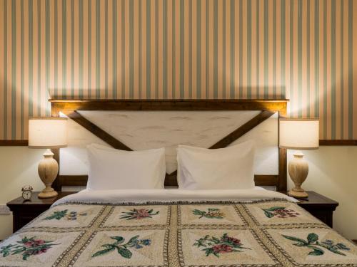 Katil atau katil-katil dalam bilik di The Whispering Pine Lodge