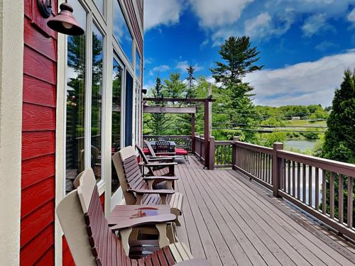 a deck with benches on the side of a house at At the Start of It All in McHenry