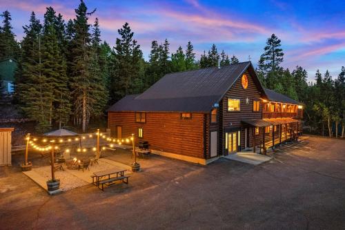 a log cabin with lights in front of it at Duck Creek Village Inn in Duck Creek Village