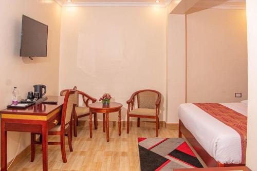 TV a/nebo společenská místnost v ubytování Vickmark Hotel