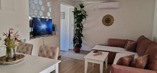 a living room with a couch and a table at Villa Bali - Aladinici in Stolac