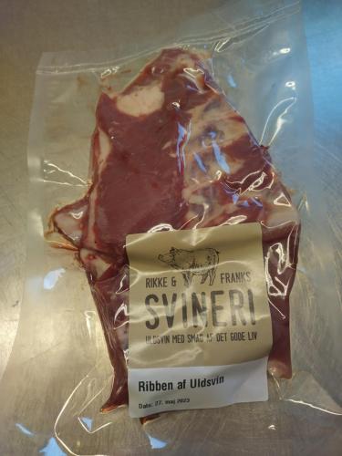a piece of chocolate in a plastic bag with a sign at Rikke og Franks Svineri in Lemvig