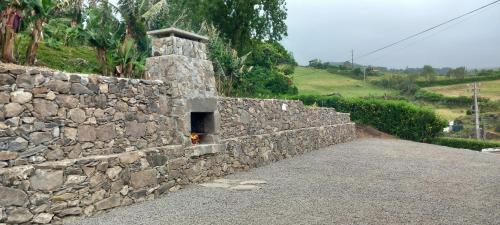 a stone wall with a small oven in it at Fazenda Apartments - Apartment 2 in Lajes das Flores