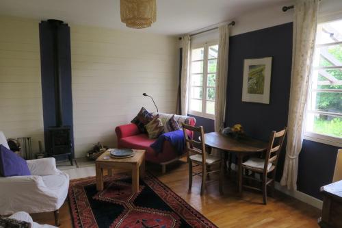 a living room with a couch and a table at No.5 in Saint-Girons