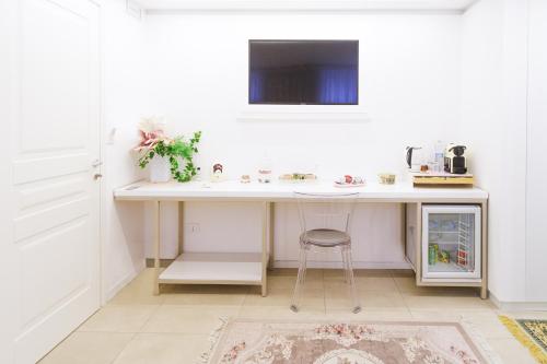 a white desk with a chair in a room at Le Monachelle Luxury in Eboli