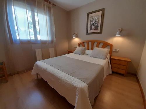 Ένα ή περισσότερα κρεβάτια σε δωμάτιο στο Hostal Gúdar