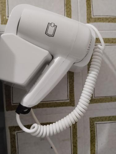 a white phone is hanging on a wall at Hotel Ristorante Stella in Palestrina