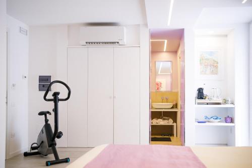 a room with a treadmill in front of a door at Le Monachelle Luxury in Eboli