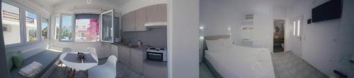 アダマスにあるKamakaris Roomsの2つの景色を望む客室で、テーブル付きのキッチンが備わります。