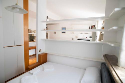 Postel nebo postele na pokoji v ubytování Tamara e Gerardina House in Trastevere