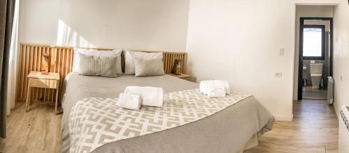 Кровать или кровати в номере Senderos Aparts & Suites