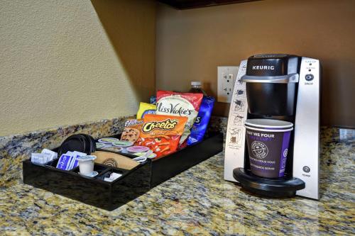 a coffee maker and snacks on a counter in a hotel room at Homewood Suites by Hilton Kalispell in Kalispell