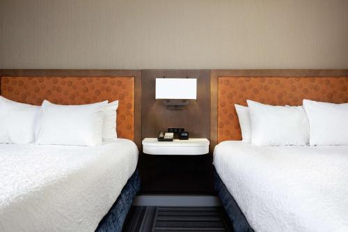 two beds sitting next to each other in a hotel room at Hampton Inn Kingsport in Kingsport