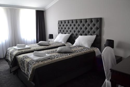 Postel nebo postele na pokoji v ubytování Hotel Emi