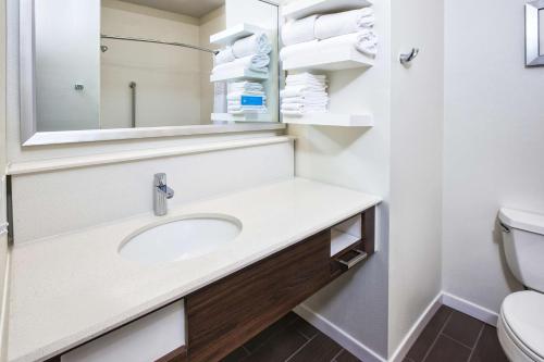 a bathroom with a sink and a toilet at Hampton Inn & Suites Los Alamos in Los Alamos