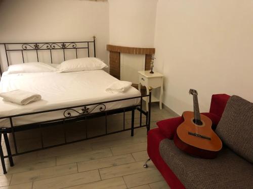 Postel nebo postele na pokoji v ubytování La piccola casa di Tania in via Fiore