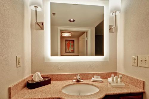 a bathroom with a sink and a mirror at Homewood Suites by Hilton Lexington Fayette Mall in Lexington