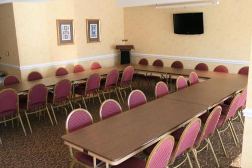 a conference room with a table and chairs at Hampton Inn Laurinburg in Laurinburg