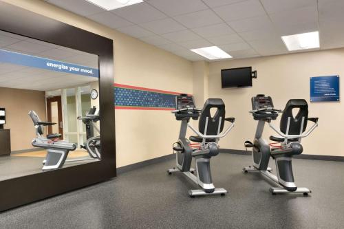 a gym with cardio equipment and a mirror at Hampton Inn & Suites Mahwah in Mahwah