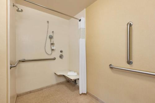 a bathroom with a shower and a toilet at Hampton Inn & Suites Mahwah in Mahwah